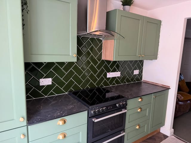 Green herringbone kitchen splashback tiled by Professional Tiling Southwest